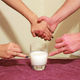 Illustration for article titled Astounding: 7 Incredible Photos Of Hands Pointing To Glasses Of Milk With Their Ring Fingers